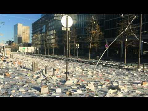 Striking refuse collectors litter the streets of Paris in protest at private contracts