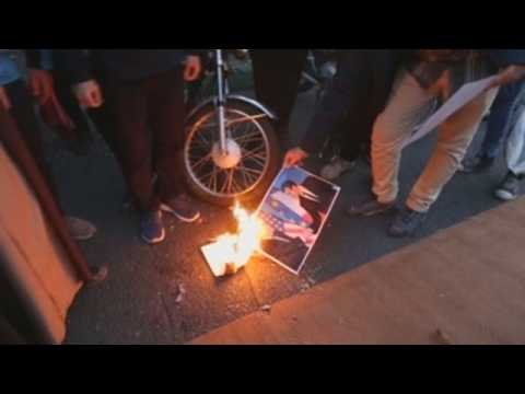 Protesters burn photos of Macron in front of French embassy in Tehran