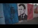 A mural against French President Macron in Gaza