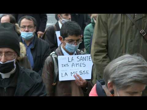Paris's Catholics pray in streets demanding return of regular mass