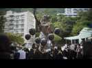 Hong Kong students chant pro-democracy slogans in rare act of defiance