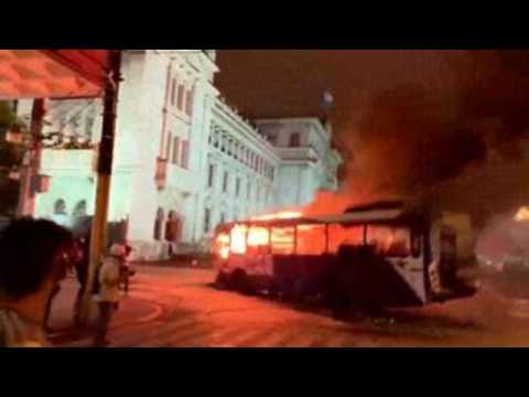 Bus burned in front of gov't office in Guatemala City during protest