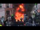 Fires, sounds of explosions as thousands protest new security law in Paris