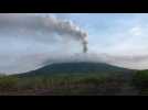 Rumbling Indonesian volcano belches column of smoke