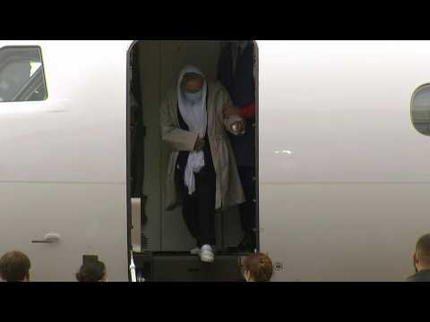 Elderly French aid worker arrives in France after Mali hostage ordeal