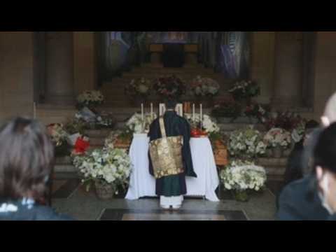 Relatives and friends give final farewell to Kenzo Takada