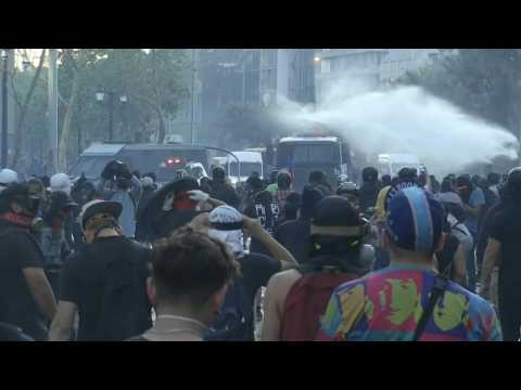 Chilean police fire water cannons at anti-government protesters