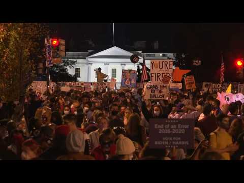 A sea of people celebrates outside White House as Trump era ends