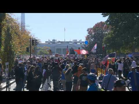 People celebrate outside the White House as Joe Biden elected US president