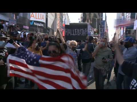 People celebrate Joe Biden's victory in New York's Times Square