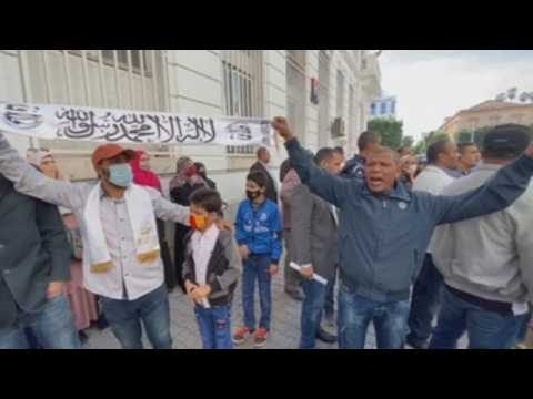 Dozens march in Tunis against French president over Mohammed cartoons