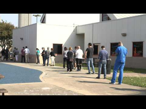 Texas residents line up in Houston for early in-person voting