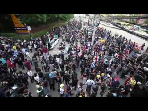 Anti-government protesters demonstrate outside SCB headquarters in Bangkok