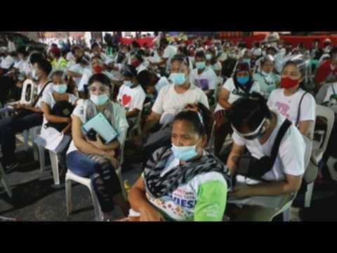 Citizens affected by pandemic claim financial aid in Philippines