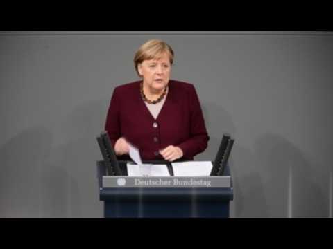 Merkel defends decision to tighten Covid measures