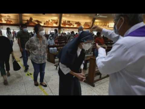 Filipinos gather at churches in the Philippines to celebrate Ash Wednesday