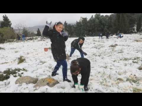 Locals enjoy the snow in West Bank