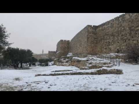 Jerusalem residents wake up to snow-covered city