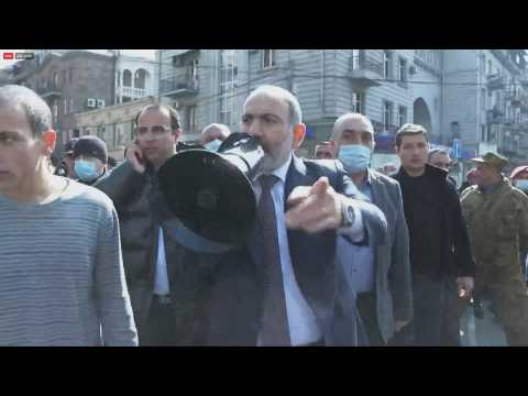 Armenian PM marches through capital with hundreds of supporters