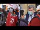 Suez employees demonstrate in front of Veolia HQ in Paris