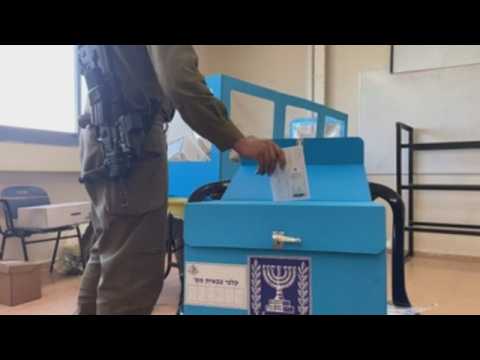 Israeli soldiers cast their votes in early elections