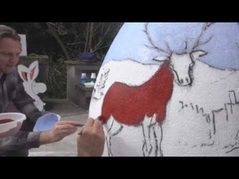 Painters and pupils decorate giant Easter eggs at the Zagreb Zoo
