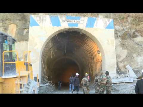 Indian rescuers try to reach trapped workers in tunnel