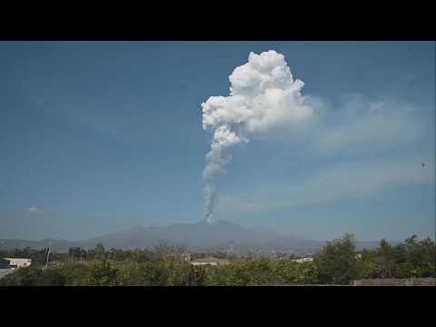 Mount Etna spews smoke and ash