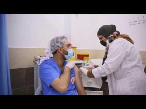 Red Crescent vaccinates Palestinian health workers in Hebron