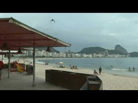 Scene on Rio's Copacabana beach as ban on beach bars, vendors comes into force amid virus surge