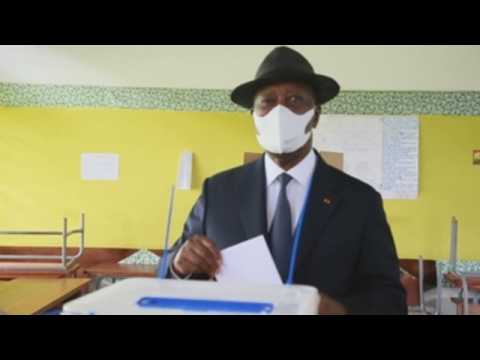 Ivory Coast president Alassane Ouattara casts his vote in parliamentary elections