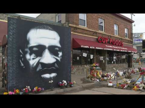 Flowers at the George Floyd Mural in Minneapolis ahead of trial for US policeman charged with Floyd's death