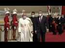 Pope Francis shakes hands with Iraqi PM upon his arrival in Baghdad