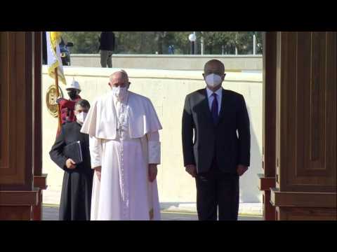Pope Francis is welcomed by Iraqi President Barham Saleh at presidential palace