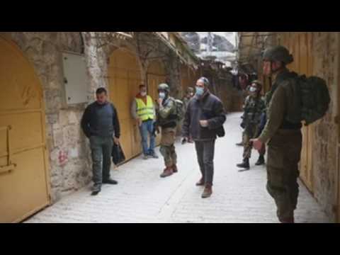 Israeli soldiers patrol streets of Hebron