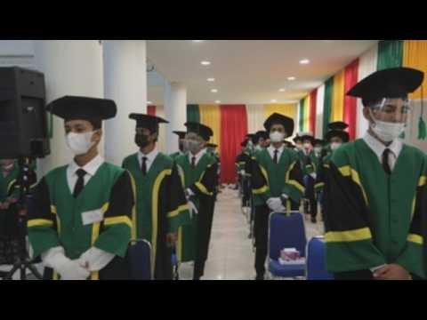 College students in Indonesia attend graduation ceremony amid pandemic
