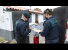 Portuguese agents distribute school homework to students in homes without internet