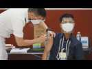 Philippine police vaccinated against COVID-19 on first day of vaccine rollout