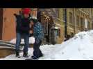 Snowboarders enjoy heavy snowfall in Kiev city centre