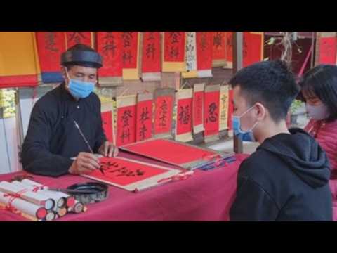 Vietnamese seek traditional calligraphy artworks in first days of Lunar New Year