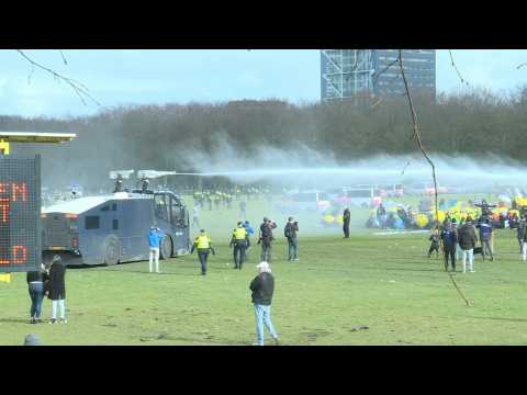 Clashes in the Netherlands as police use water cannon to disperse anti-government protesters