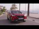 CUPRA Formentor 150 CV in Desire Red Driving in the city