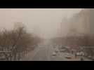 Sandstorm, pollution leave Beijing covered in thick smog