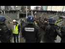 Riot police evacuate protesters from financial district
