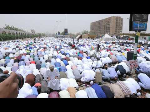 Sudanese protesters participate in Friday prayer in front of army HQ