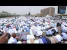 Sudanese protesters participate in Friday prayer in front of army HQ