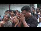 People hold a vigil outside St. Anthony's Shrine