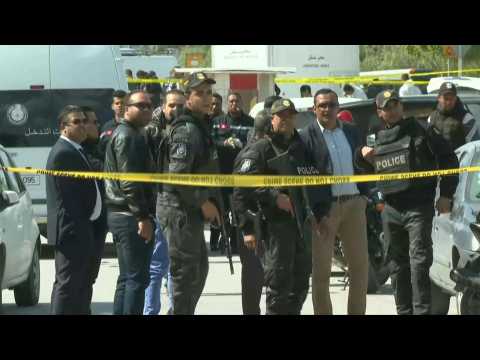 Tunisian police set a cordon around an explosion site near the US embassy