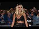 Rita Ora says her new single helped her overcome heartbreak