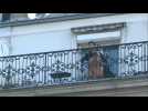 Coronavirus: Cellist Camilo Peralta performs on his balcony in Paris